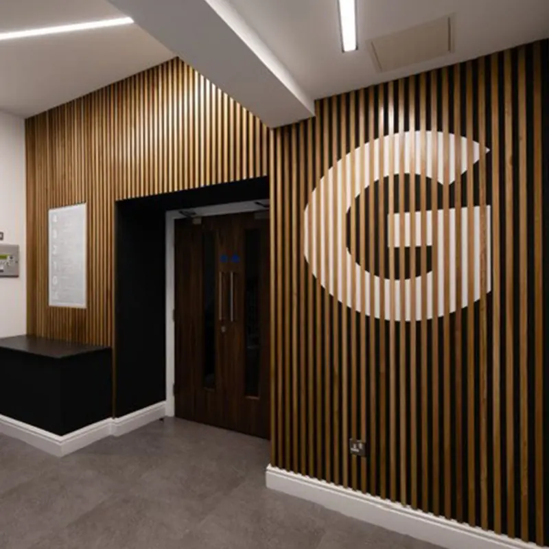 Double doors with overhead door closers in an office entrance lobby